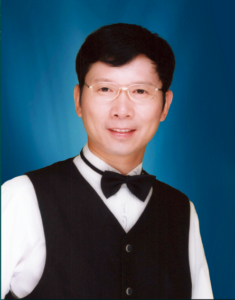 Photograph of man with Chinese features, formally dressed.