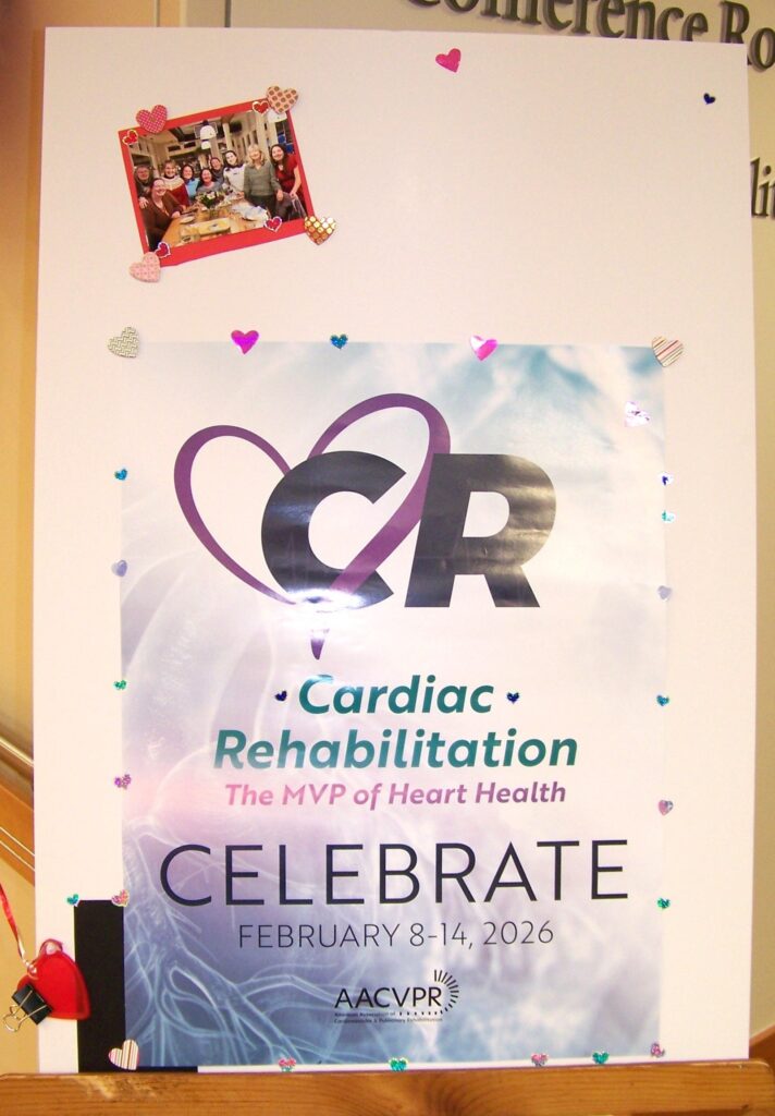 A poster that proclames Cardiac Rehabilitation: The MVP of Heart Health. Celebrate. A photo of a group of people (the rehab team?) is taped onto the poster.