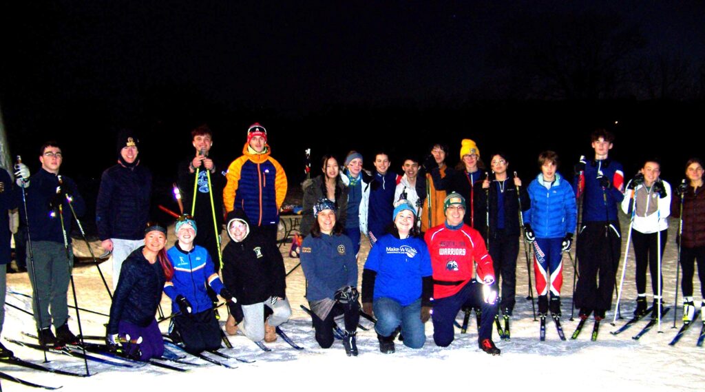 A large group of young and eager skiers.