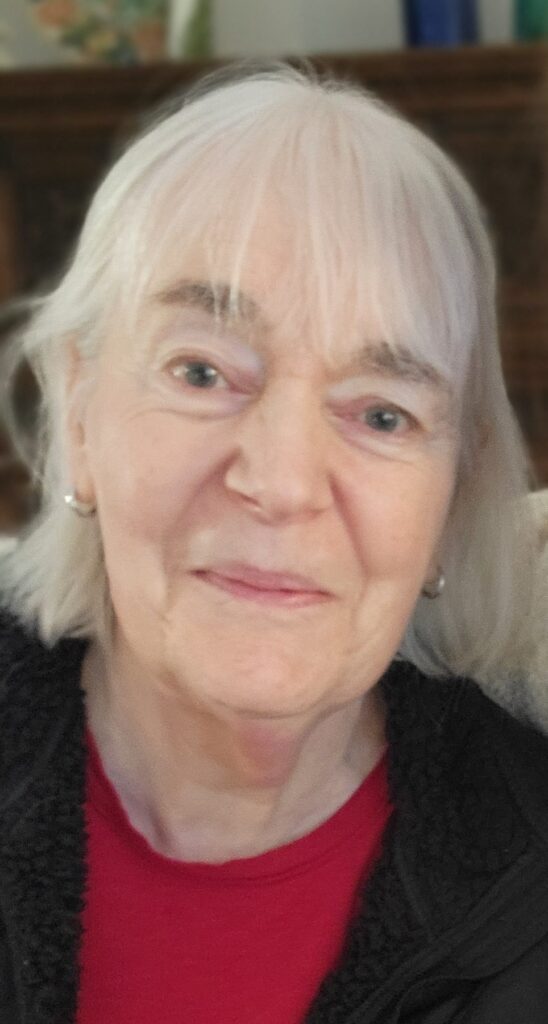 An older woman smiling faintly