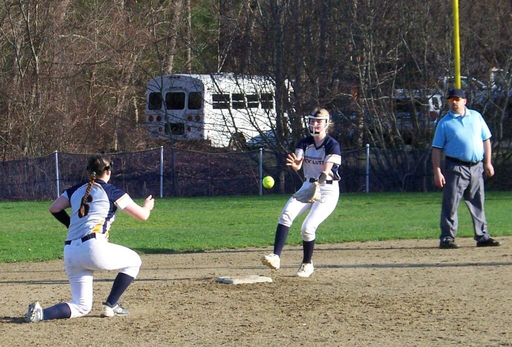 Alice Rosecan (#6) and Stacey Loram combine to force out a Newton South runner. Photo: James Conboy