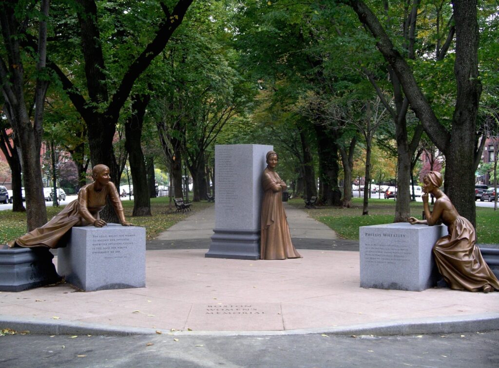 Three sculpures of women with pedestals; but the women have stepped off.