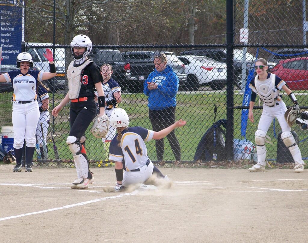 Player #14 slides into base.