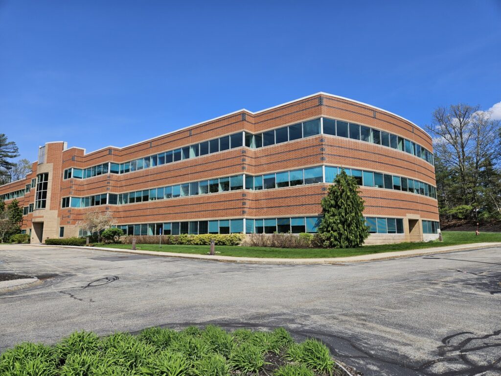 A large brick and glass building.
